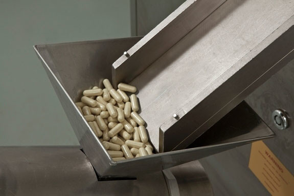 Manufactured Capsules prior to entering the De-Duster